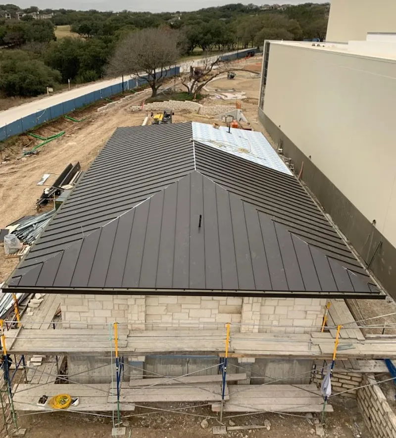 Metal roof new construction with scaffolding in Westview