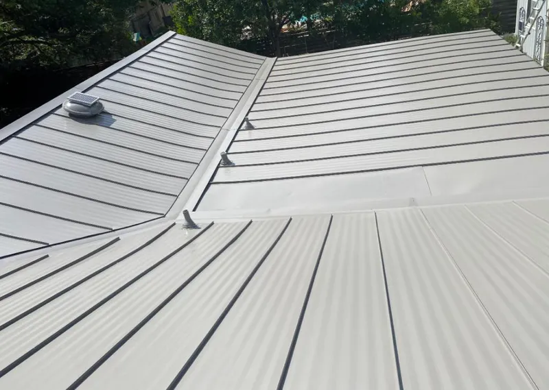 Solar attic fan installed on a metal roof for Roof Ventilation in Westview