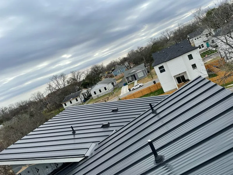 Standing seam metal roof panels with vents for Skylight Repair in Westview